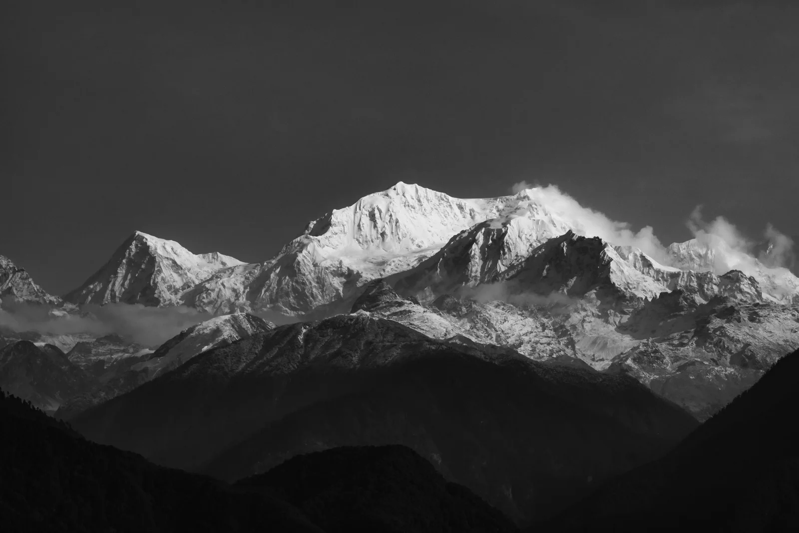 Breathtaking view of the snow-capped Himalayas from Pelling, India in monochrome.