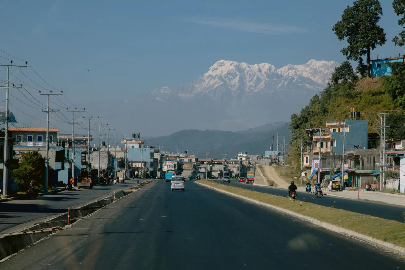 A mountain road through the green monsoon hills of Nepal