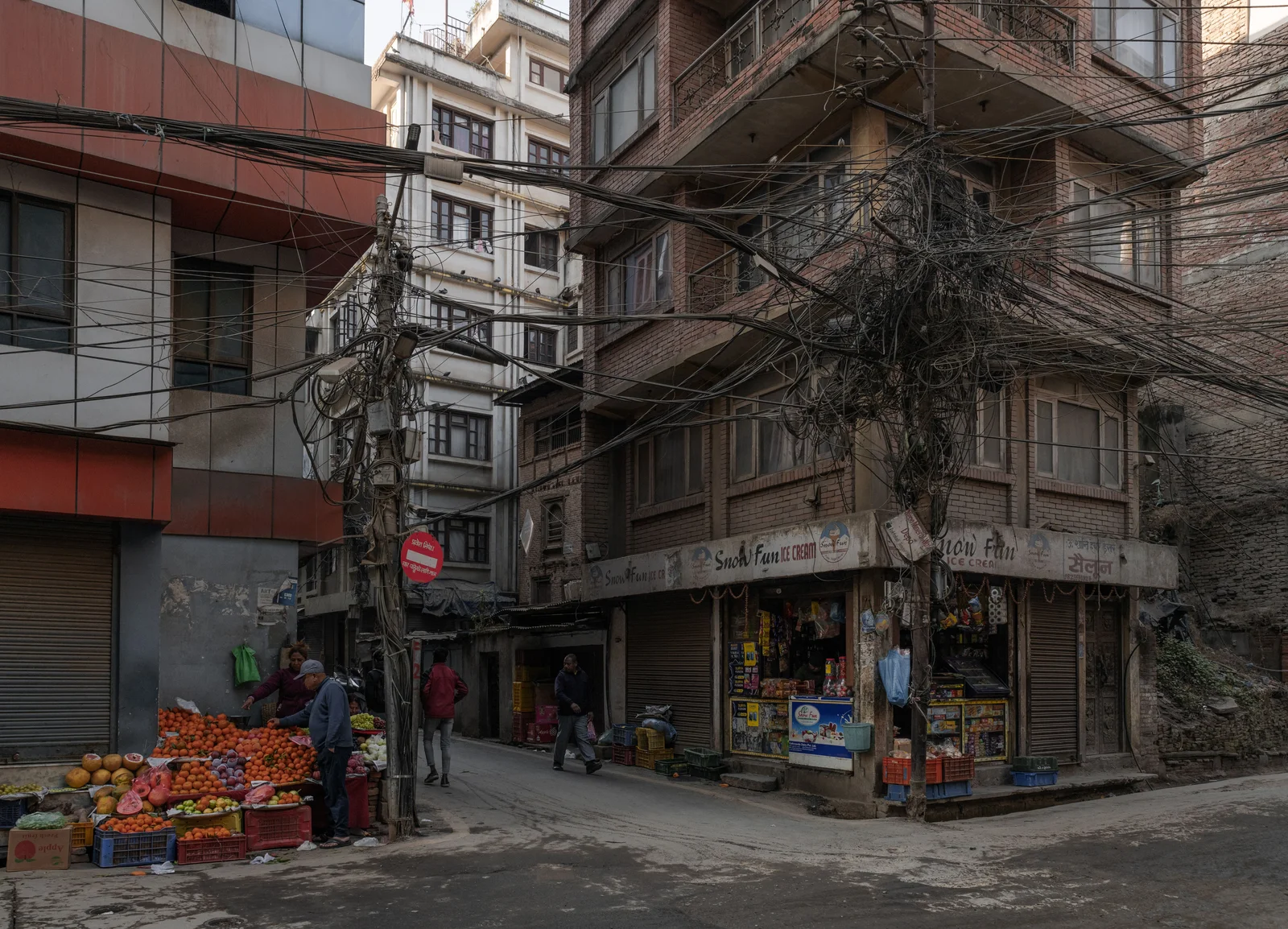 A street corner in Kathmandu with a fruit stall